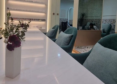 Modern decor at Polish Beauty Lounge Salon, Umm Al Quwain with plush seating and floral accents.