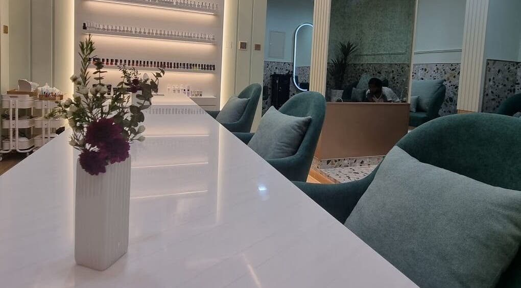 Modern decor at Polish Beauty Lounge Salon, Umm Al Quwain with plush seating and floral accents.