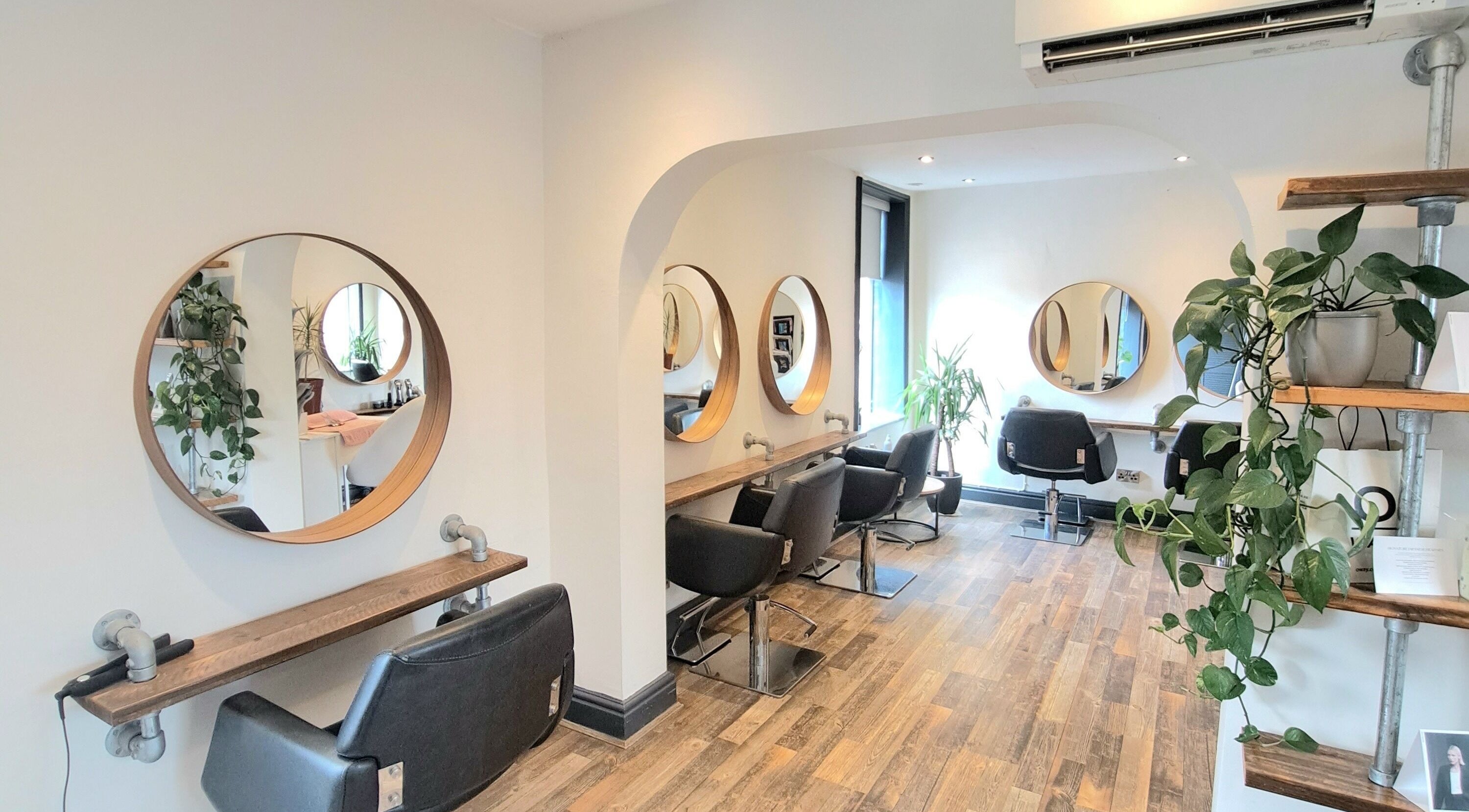 Elegant salon chairs and mirrors at Salon in the Square, Market Bosworth, England, GB.