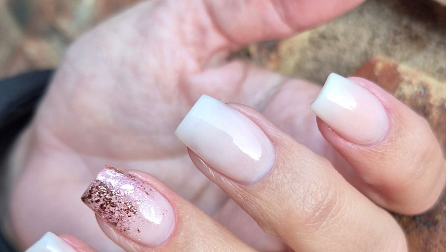 Close-up of metallic glitter nails at Monè Lake Nail Artist, Mashishing, Mpumalanga, ZA.