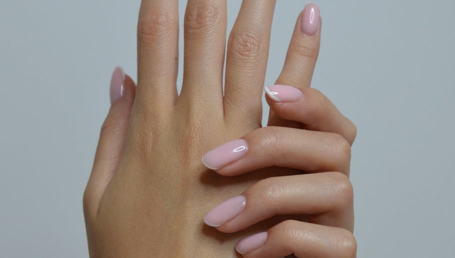 Manicured nails in soft pink at Casa Artistry, Campsie, New South Wales, AU.