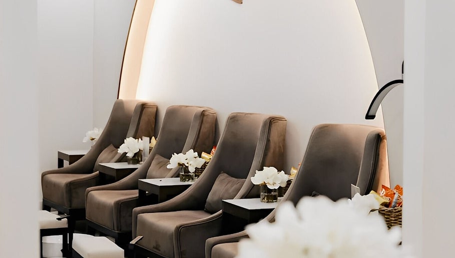 Luxurious seating area at Lish Beauty Bar, Dubai, Dubai, AE, featuring plush chairs and modern décor.