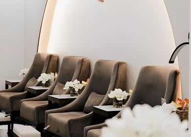 Luxurious seating area at Lish Beauty Bar, Dubai, Dubai, AE, featuring plush chairs and modern décor.