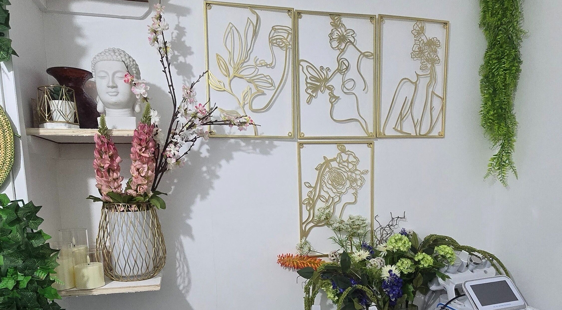 Elegant decor featuring florals and art at Ivy Nat Beauty Lounge, London, England, GB inspires tranquility.