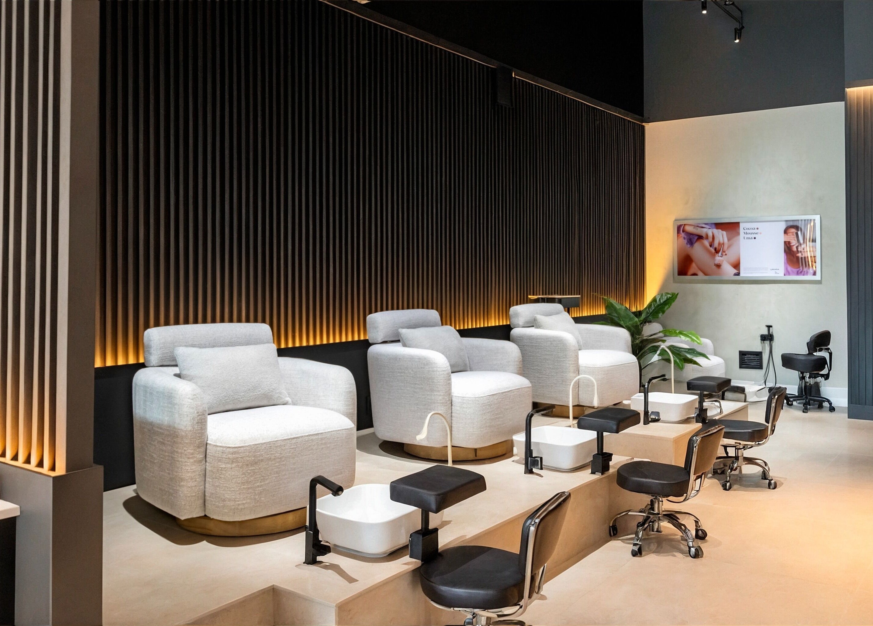 Elegant pedicure area at UMARA, Miami, Florida, US with plush seating and modern decor.