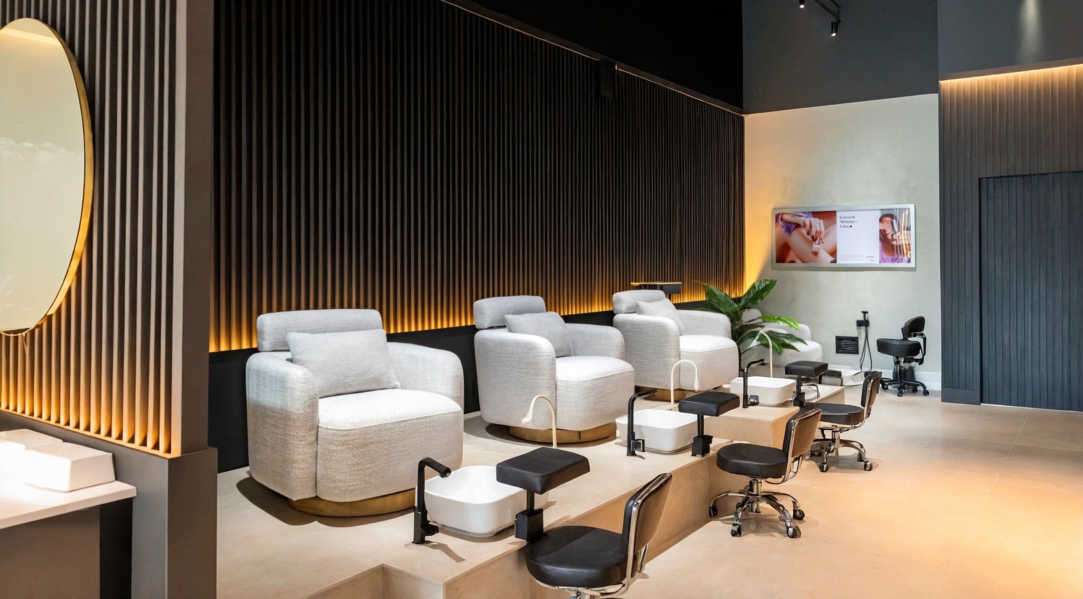 Elegant pedicure area at UMARA, Miami, Florida, US with plush seating and modern decor.