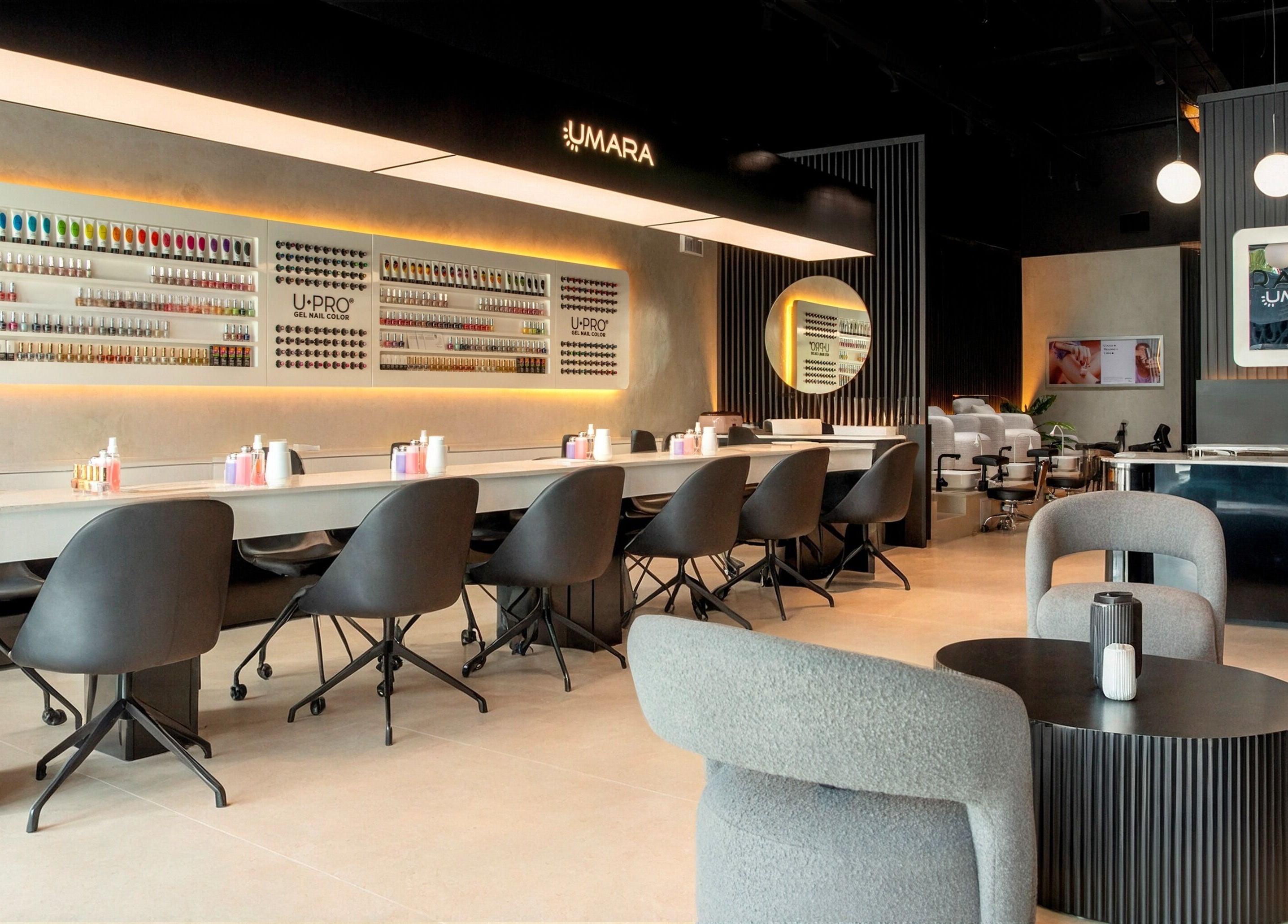 UMARA's stylish nail salon interior in Miami, Florida, showcasing modern decor and seating arrangement.