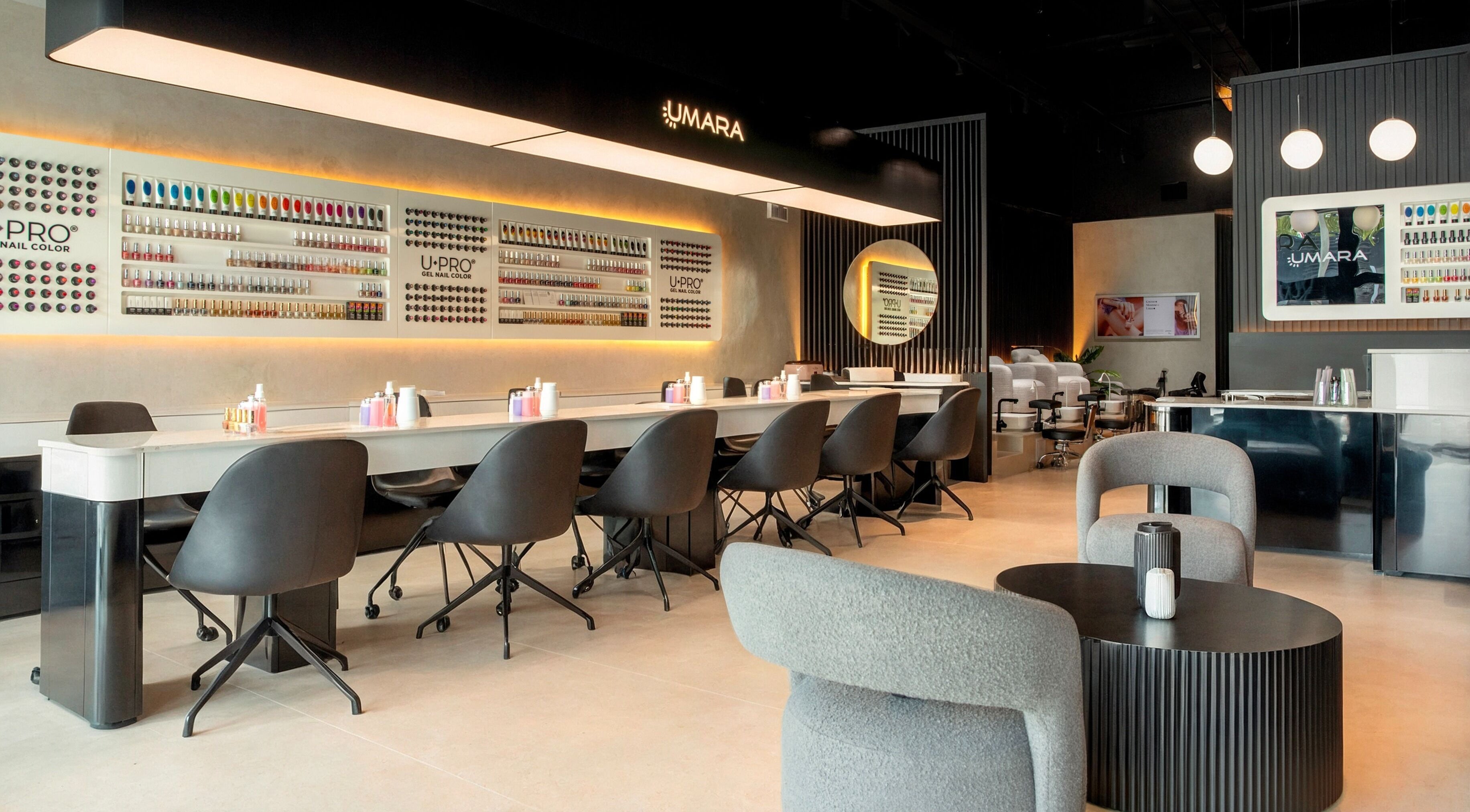 UMARA's stylish nail salon interior in Miami, Florida, showcasing modern decor and seating arrangement.