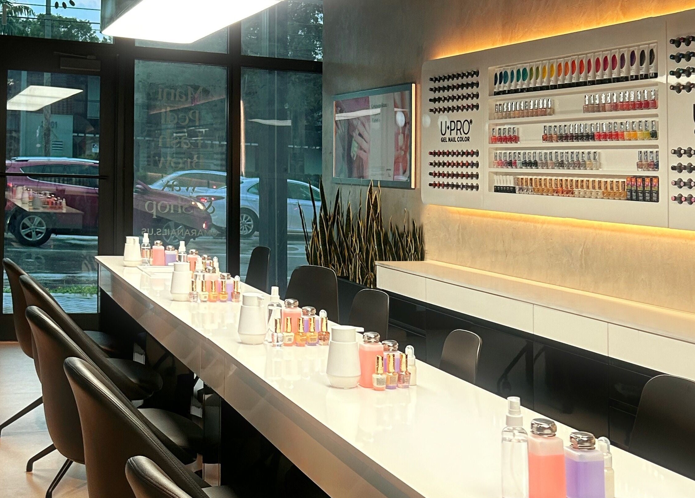 UMARA nail bar in Miami, Florida featuring a sleek manicure station with vibrant polish display.