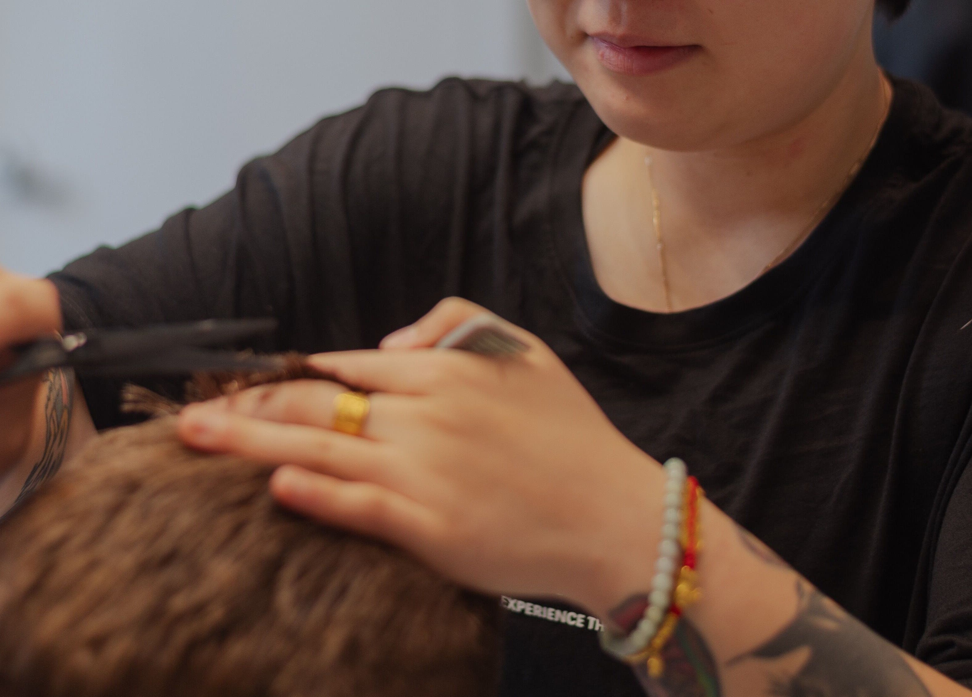 Hair stylist at OMALIA. ST LEONARDS expertly cutting hair in St Leonards, New South Wales, AU.