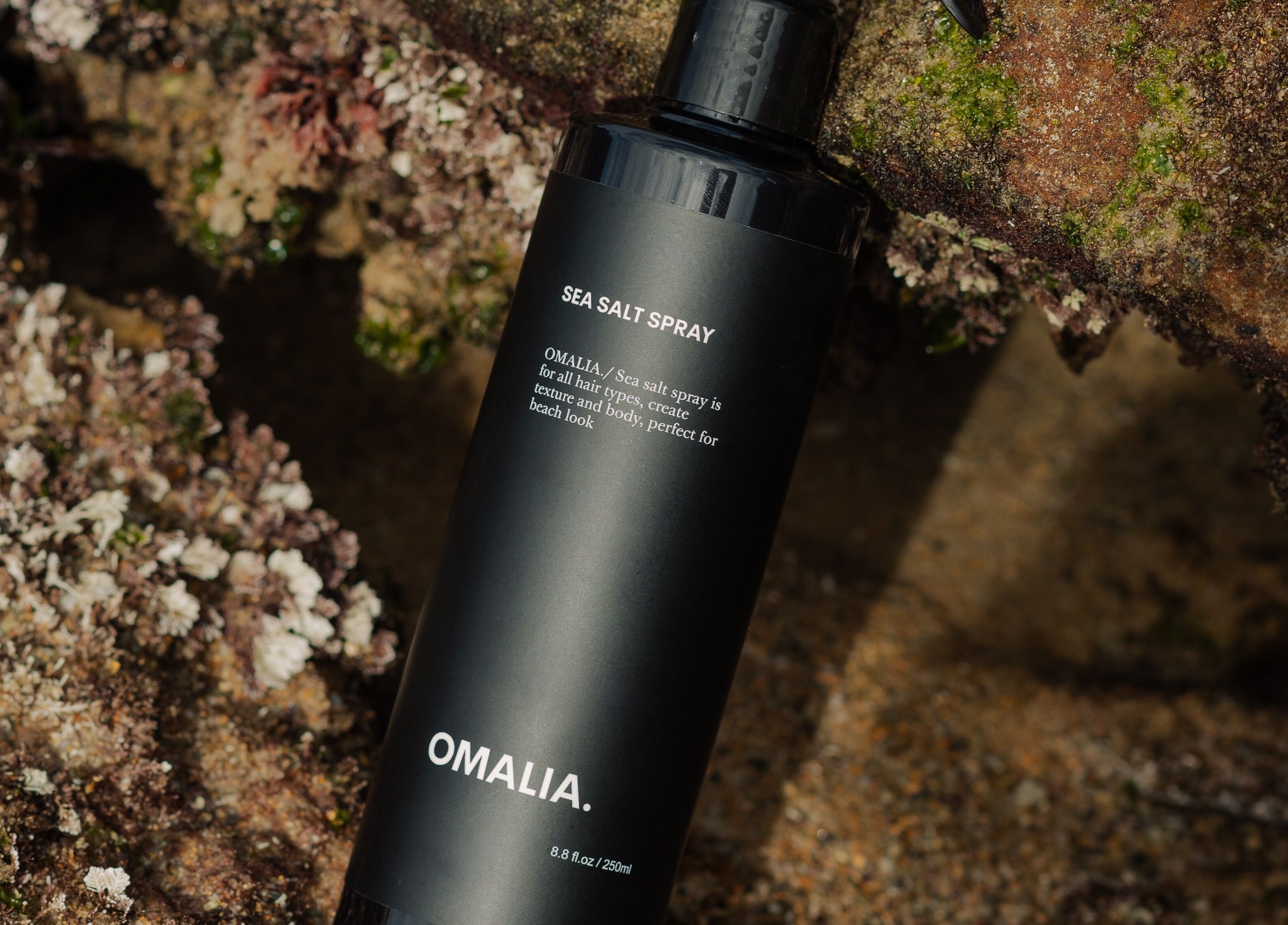 OMALIA. ST LEONARDS sea salt spray, bottle on rocky surface, St Leonards, New South Wales, AU.