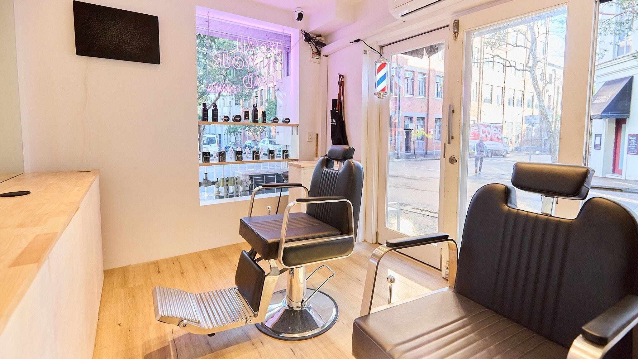 Modern salon interior at OMALIA. SURRY HILLS, featuring sleek chairs and bright decor in Surry Hills, New South Wales, AU.