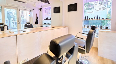 OMALIA. SURRY HILLS salon interior, showcasing modern styling chairs and decor in Surry Hills, New South Wales, AU.