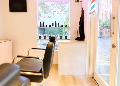 Modern salon interior at OMALIA. SURRY HILLS showcasing styling chairs and products in Surry Hills, New South Wales, AU.