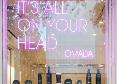 OMALIA. SURRY HILLS neon sign and products in Surry Hills, New South Wales, AU window display.