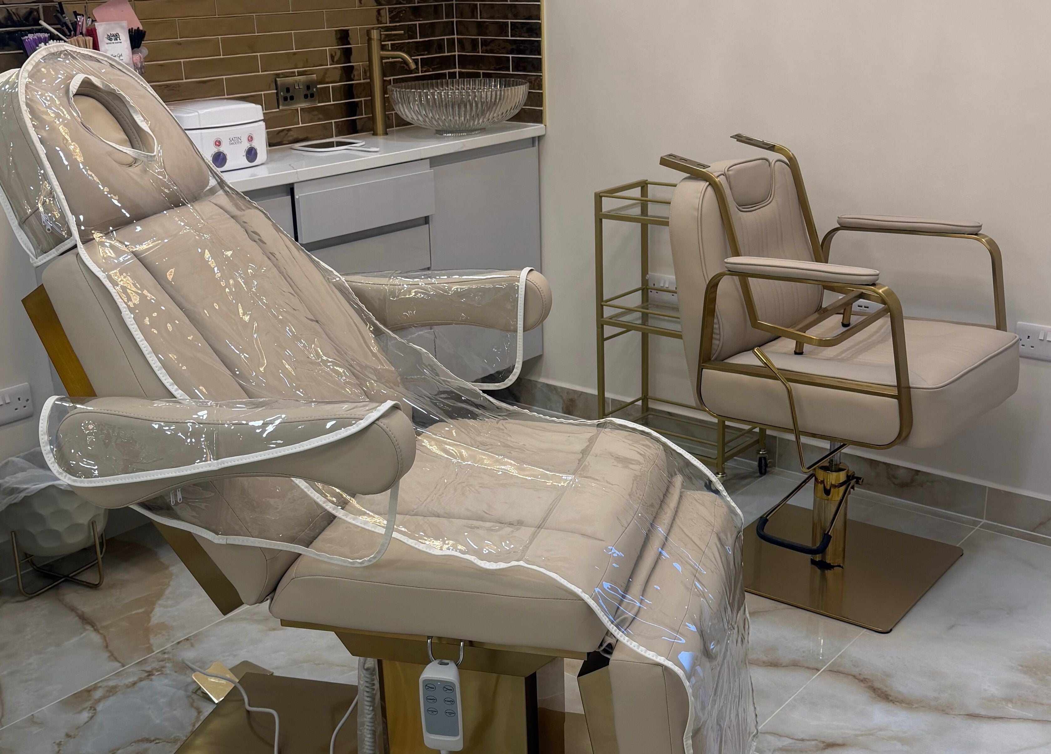 A luxurious beige beauty chair at Polished Beauty, Telscombe Cliffs, England, GB, ready for clients.