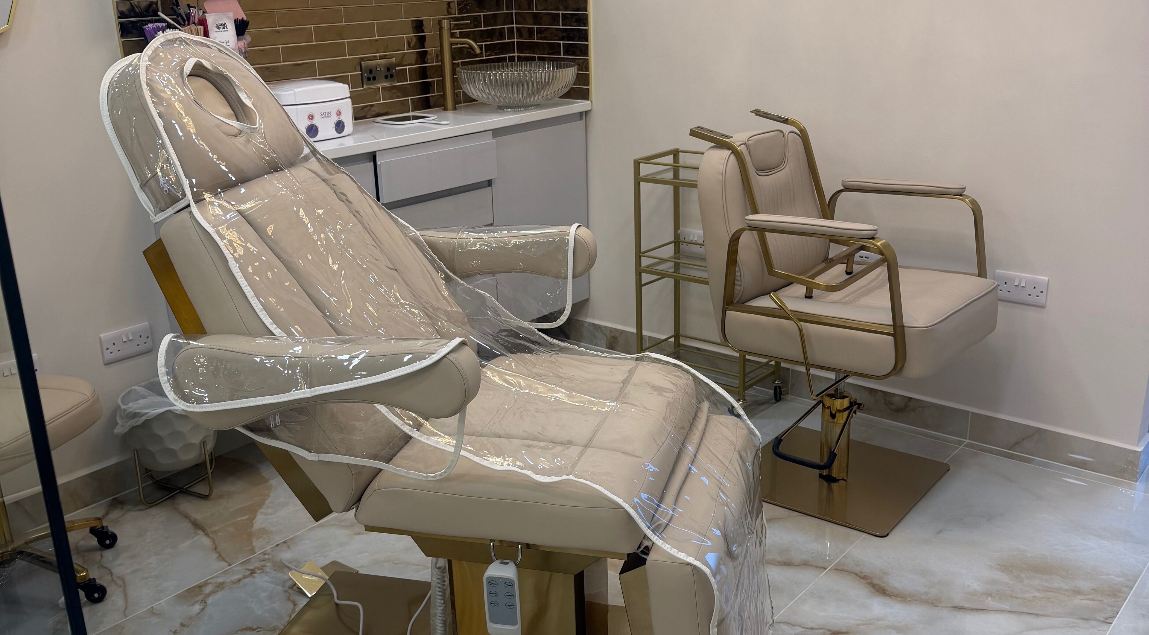 A luxurious beige beauty chair at Polished Beauty, Telscombe Cliffs, England, GB, ready for clients.