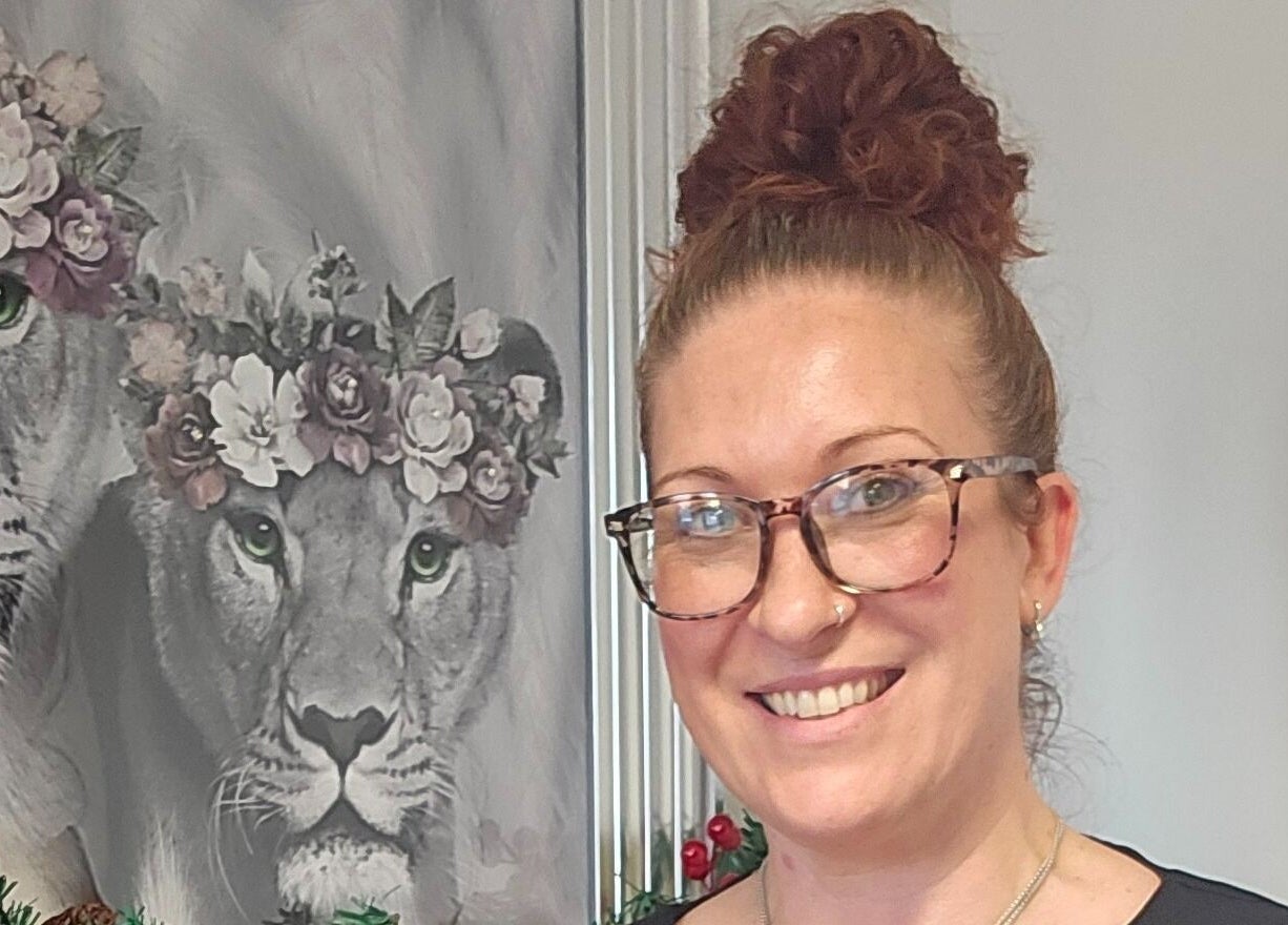 Artwork of floral-crowned lions displayed at Lioness' Den in Elland, England, GB.