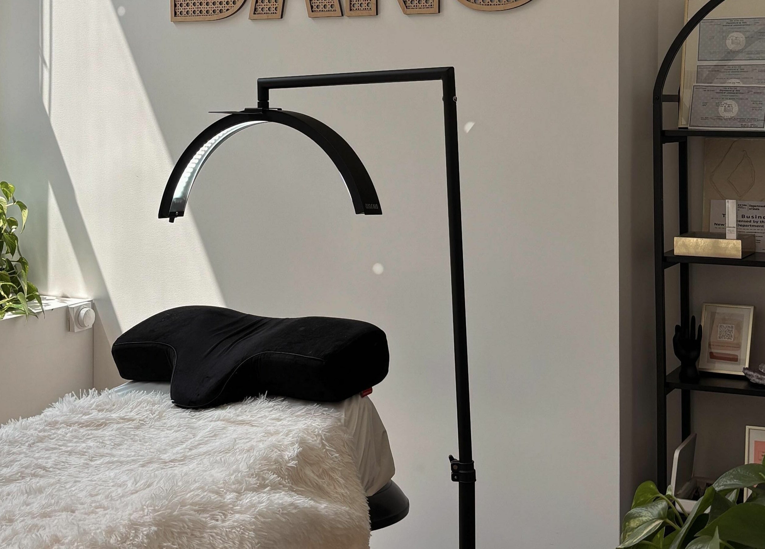 Relaxing treatment area at Glam by Dang, New York, New York, US with bright light and calming decor.