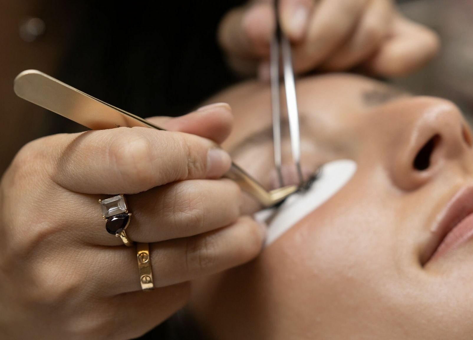 Close-up of lash extension application at Glam by Dang, New York, New York, US.