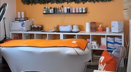 Treatment room at Peach Wax Studio in Kelso, Scotland, GB, showcasing a cozy and inviting ambiance.