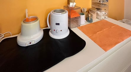 Peach Wax Studio in Kelso, Scotland, GB, showcasing waxing equipment on a neatly arranged counter.