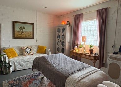 Serene massage room at Fusion Therapeutic Bodywork in Tucson, Arizona, US featuring a cozy table and soothing decor.