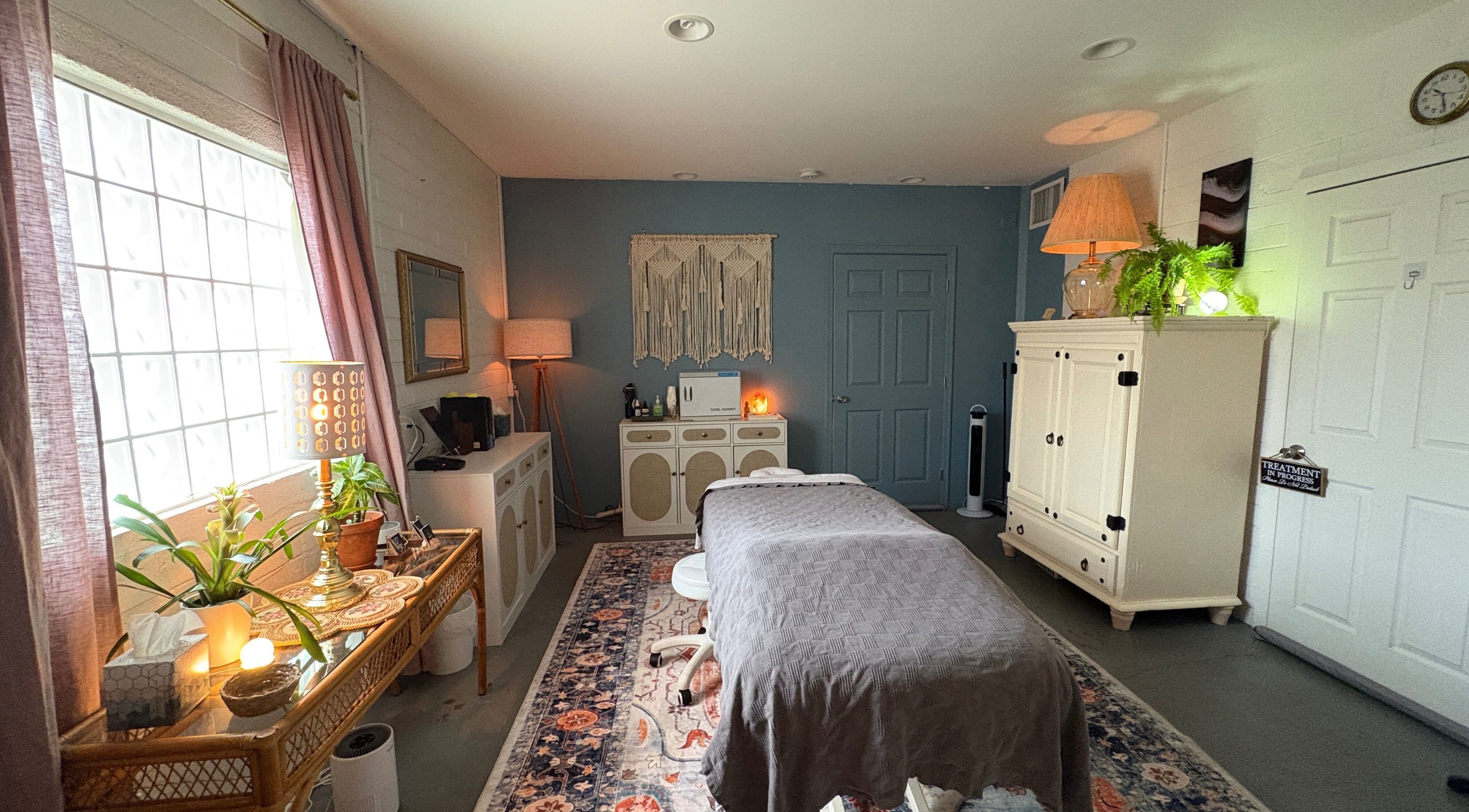 Serene massage room at Fusion Therapeutic Bodywork in Tucson, Arizona, US, featuring calming decor and soft lighting.