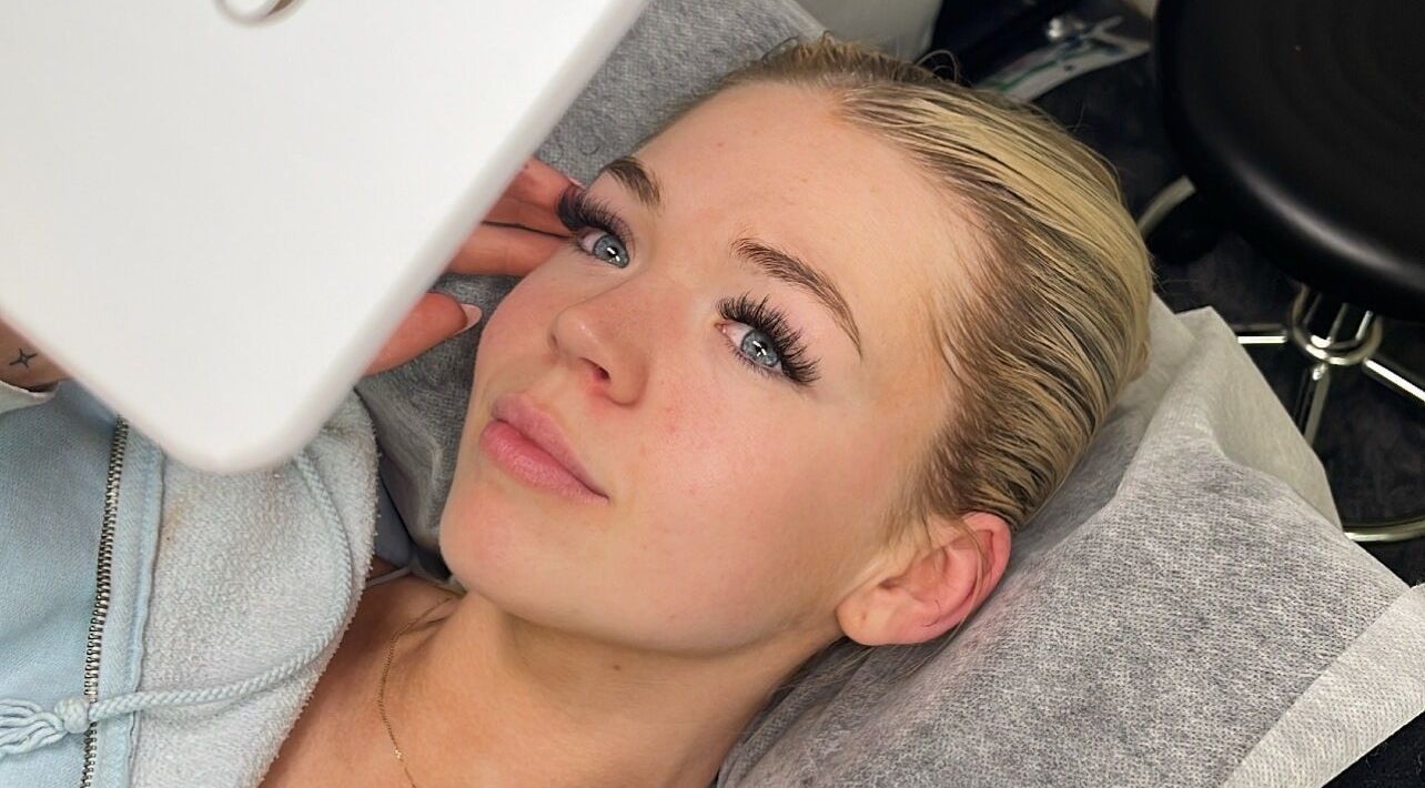Woman receiving eyelash extensions at ByDivine Lash Artistry, Melbourne, Victoria, AU.