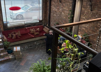 Warm, inviting lounge area at ByDivine Lash Artistry in Melbourne, Victoria, AU with rustic decor.