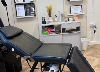 Modern treatment chair at Megan Reid Hair Design, Clydebank, Scotland, GB offering relaxing wellness services.
