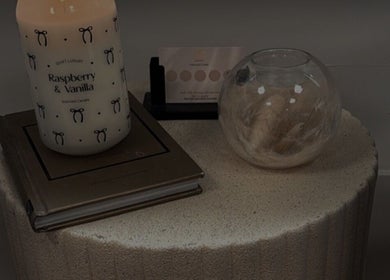 Calming candle display at Megan Reid Hair Design, Clydebank, Scotland, GB, enhancing the salon ambiance.