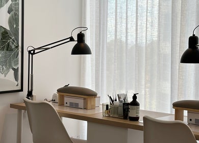 Chic nail station at Pistache Beauty Alina, St Leonards, New South Wales, AU, featuring modern decor and tools.