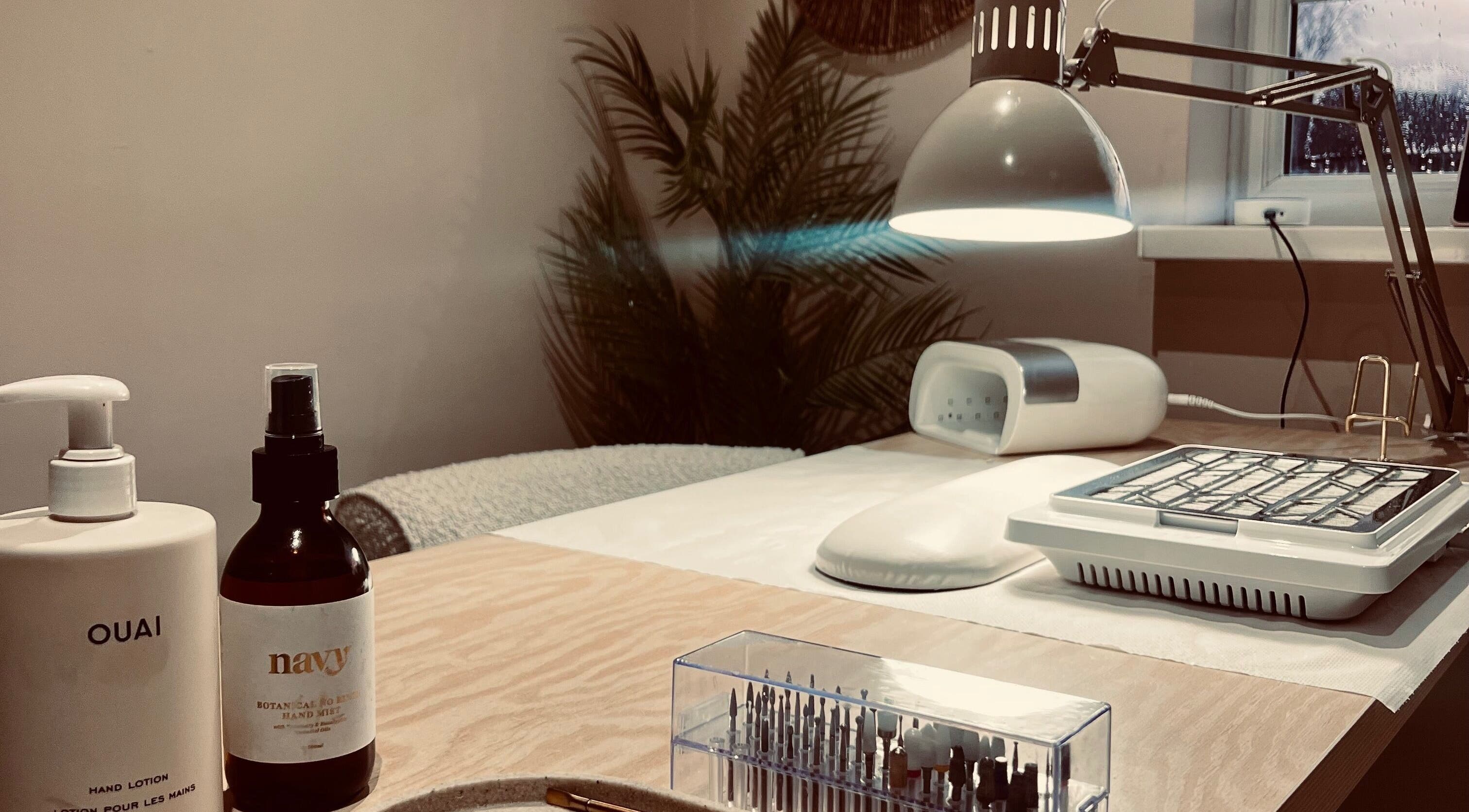 Nail care station at Jessica Beauty Babe Nails, Abercynon, Wales, GB, featuring lotions and manicure tools.