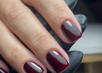 Stylish maroon nails at Jessica Beauty Babe Nails, Abercynon, Wales, GB showcasing elegance and precision.