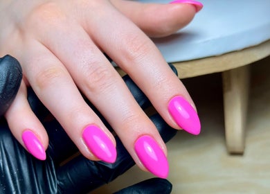 Bright pink nails styled at Jessica Beauty Babe Nails in Abercynon, Wales, GB. Vibrant manicure focus.