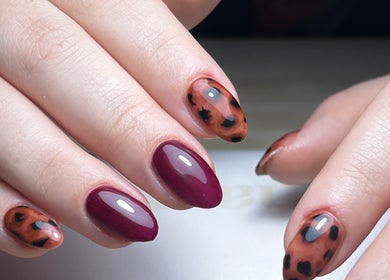Stylish nail design at Jessica Beauty Babe Nails, Abercynon, Wales, GB showcases vibrant colors and patterns.