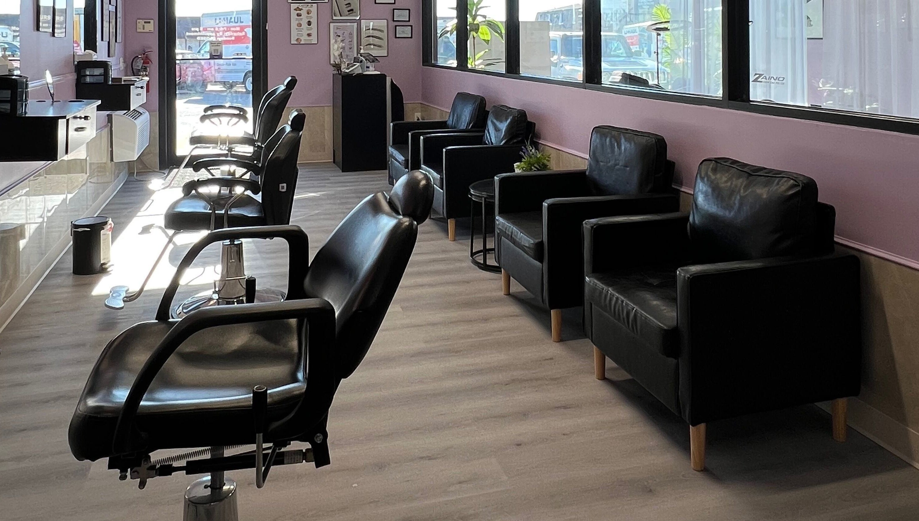 Elegant seating area at Bella Spa in Omaha, Nebraska, US with plush chairs and modern decor.