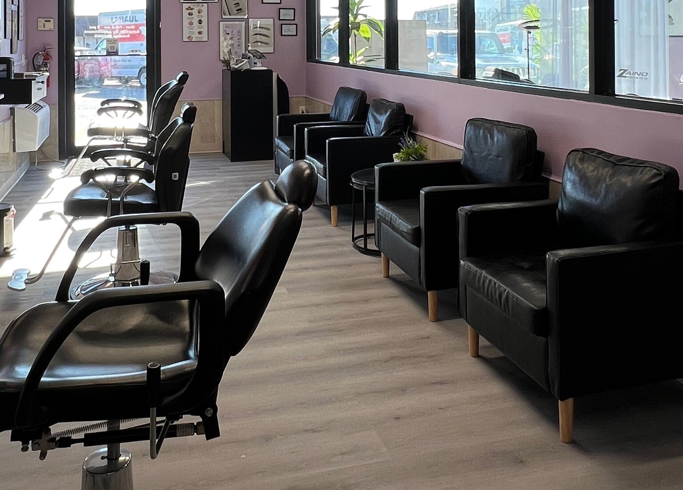 Elegant seating area at Bella Spa in Omaha, Nebraska, US with plush chairs and modern decor.