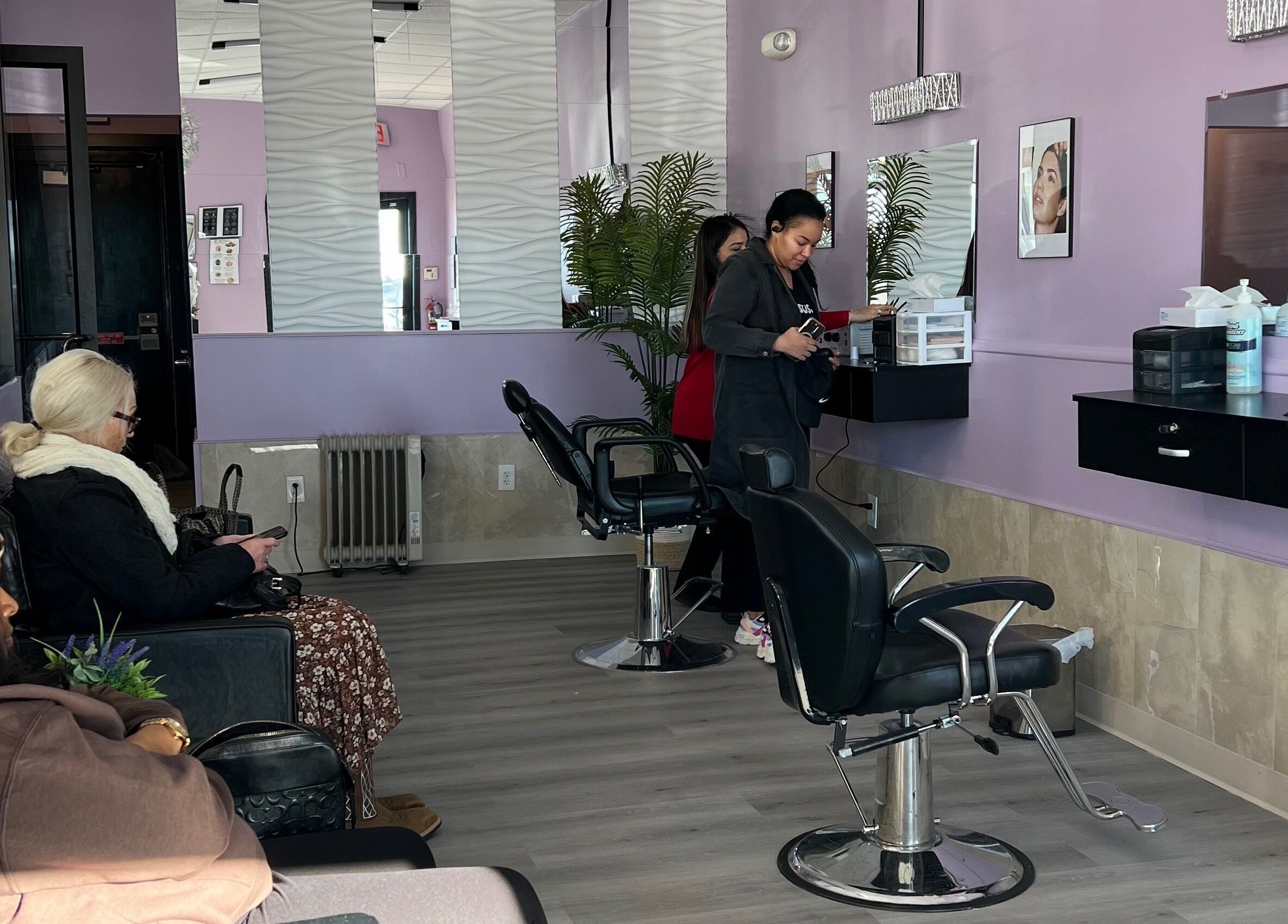 Relaxed atmosphere inside Bella Spa, Omaha, Nebraska, US showcasing stylish seating and hair styling stations.