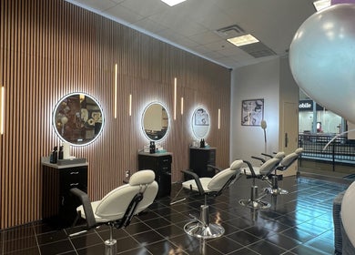 Modern salon chairs and mirrors at Bella Spa Beauty Bar in West Des Moines, Iowa, US.