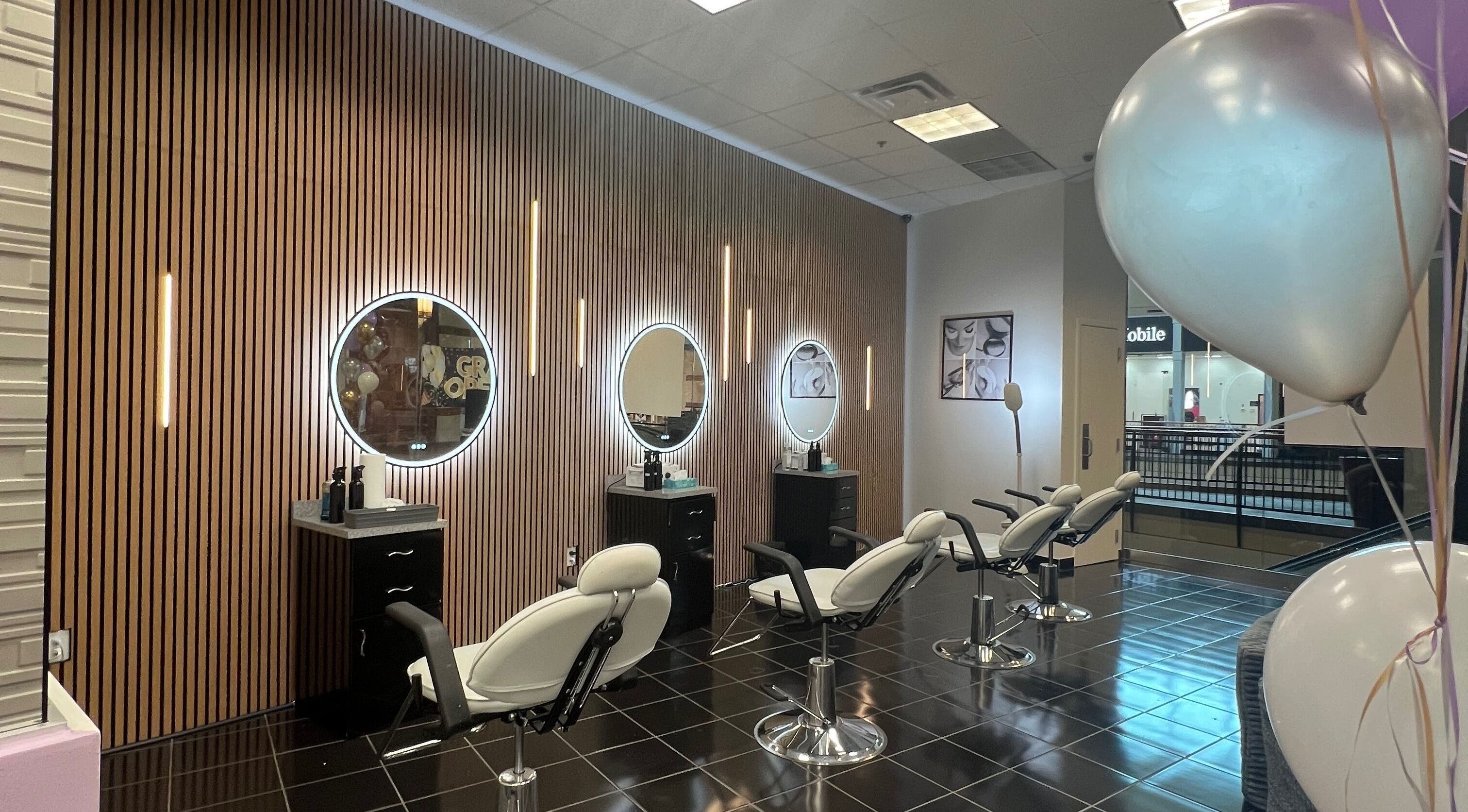 Modern salon chairs and mirrors at Bella Spa Beauty Bar in West Des Moines, Iowa, US.