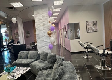 Chic interior of Bella Spa Beauty Bar, West Des Moines, Iowa, US, with modern decor and styling chairs.
