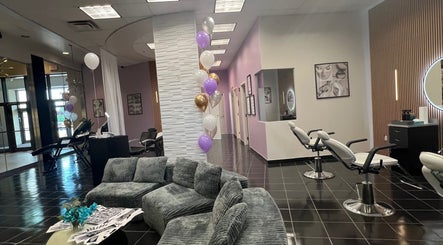 Chic interior of Bella Spa Beauty Bar, West Des Moines, Iowa, US, with modern decor and styling chairs.