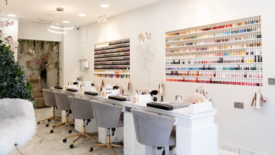 Elegant nail polish display at MW Nails and Beauty Salon, London, England, GB. Chic and inviting interior.