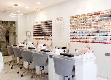 Elegant nail polish display at MW Nails and Beauty Salon, London, England, GB. Chic and inviting interior.