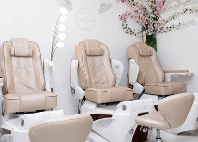 Elegant pedicure chairs at MW Nails and Beauty Salon in London, England, GB, offering a serene atmosphere.