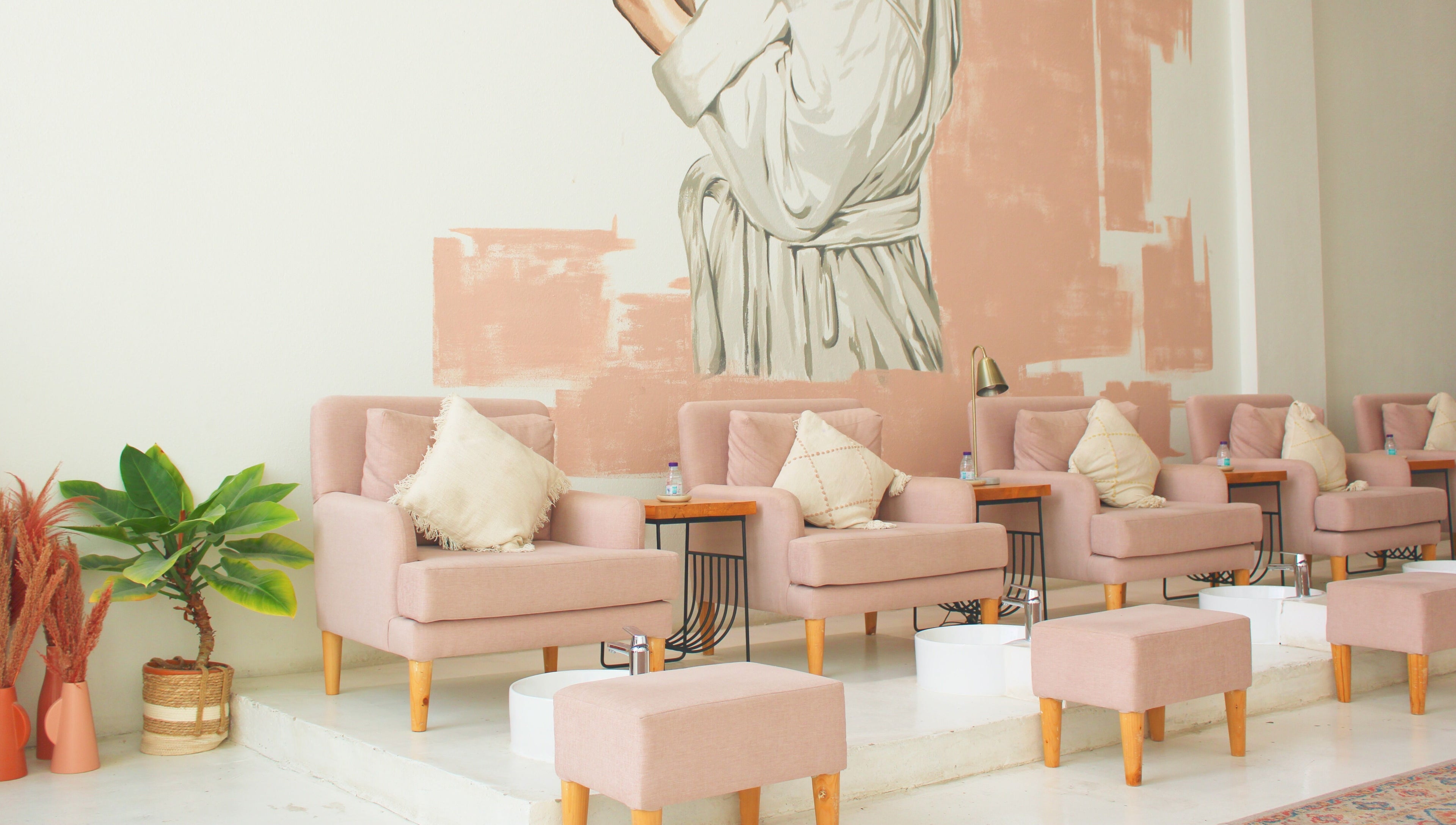 Comfortable seating area at Nash ناش, Riyadh, Riyadh Province, SA, featuring plush chairs and elegant decor.