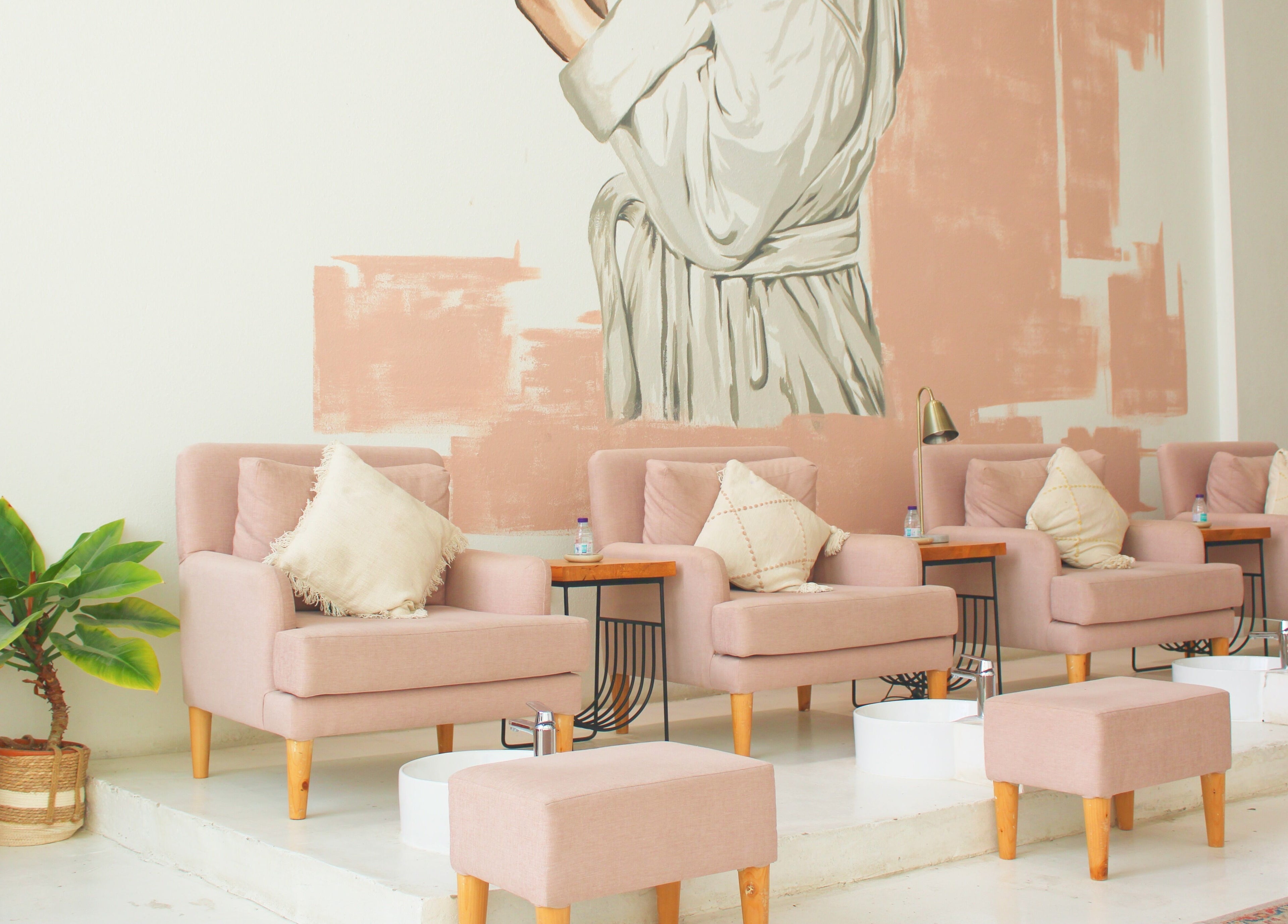 Comfortable seating area at Nash ناش, Riyadh, Riyadh Province, SA, featuring plush chairs and elegant decor.