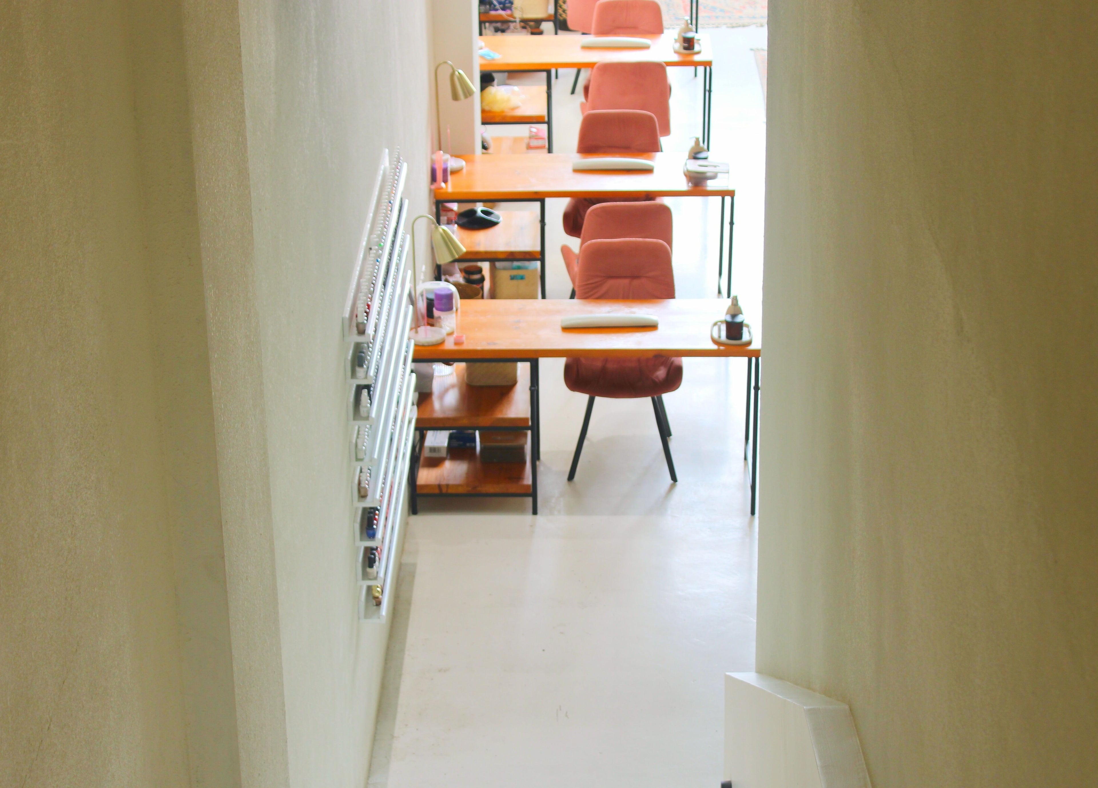 Modern nail salon desks at Nash ناش in Riyadh, Riyadh Province, SA offer a stylish and organized setting.